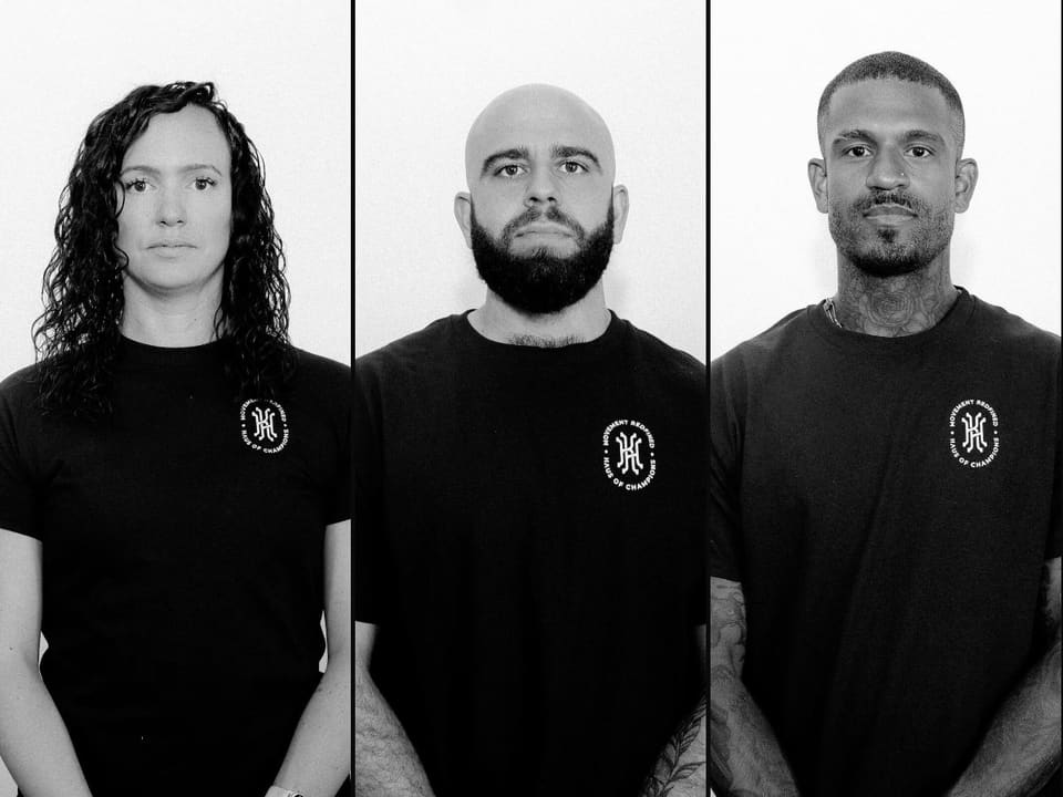 Portraits of the three Kinetic Haus founders side by side in branded shirts